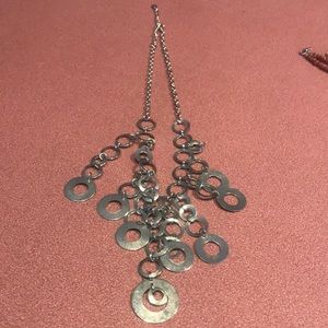 This silver toned circle necklace had a lot of movement